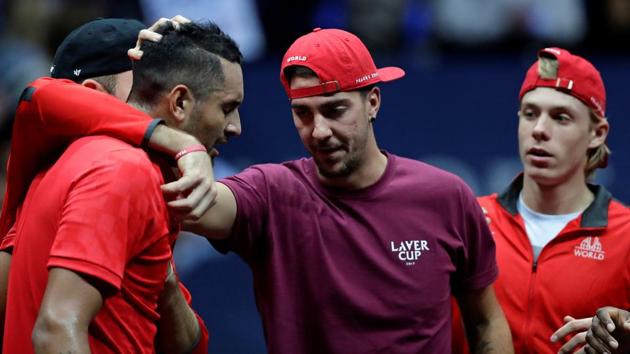 Nick Kyrgios of team World is comforted by team mates after his loss against Roger Federer. (REUTERS) Nick Kyrgios of team World is comforted by team mates after his loss against Roger Federer. (REUTERS)