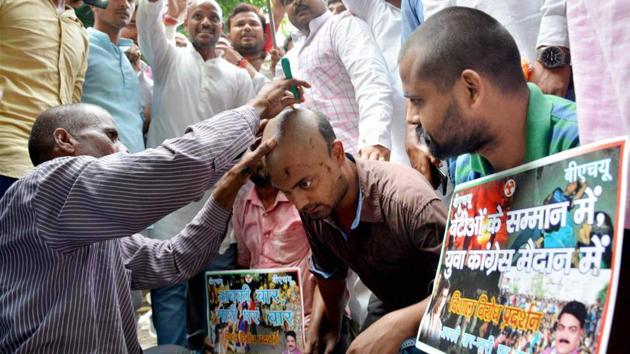 Activists of Youth Congress get their heads shaved during a protest against the police lathi charge on the female students of BHU. Several universities and colleges have seen unrest in the recent past for various reasons, including ‘anti-national’ slogans being raised in JNU and the suicide of a Dalit scholar in Hyderabad Central University, Hyderabad. (PTI) Activists of Youth Congress get their heads shaved during a protest against the police lathi charge on the female students of BHU. Several universities and colleges have seen unrest in the recent past for various reasons, including ‘anti-national’ slogans being raised in JNU and the suicide of a Dalit scholar in Hyderabad Central University, Hyderabad. (PTI)