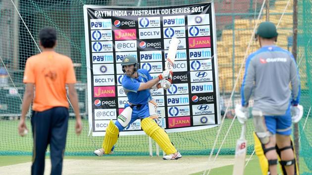 Glenn Maxwell attempts a reverse slog during a practice session ahead of the fourth ODI at the M. Chinnaswamy Stadium in Bangalore. (AFP) Glenn Maxwell attempts a reverse slog during a practice session ahead of the fourth ODI at the M. Chinnaswamy Stadium in Bangalore. (AFP)
