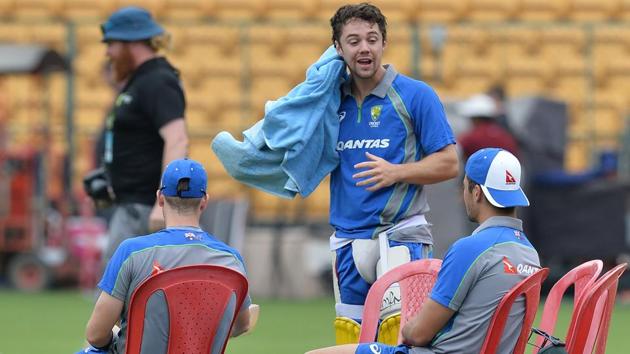 Travis Head (C) speaks with teammates after batting during a practice session ahead of the fourth ODI at the M. Chinnaswamy Stadium in Bangalore. (AFP) Travis Head (C) speaks with teammates after batting during a practice session ahead of the fourth ODI at the M. Chinnaswamy Stadium in Bangalore. (AFP)