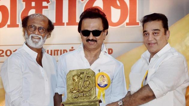 DMK Working President MK Stalin along with actor-filmmaker Kamal Haasan presenting memento to Rajnikanth at the Diamond Jubilee celebration of the party's mouthpiece Murasoli in Chennai on Thursday.(PTI)