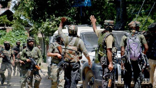 Army in action outside a house where militants were hiding during an encounter in which top three Hizbul Mujahideen commanders were killed, at Awneera in Shopian district of south Kashmir on August 13.(PTI File Photo)