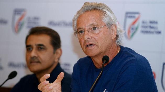 Former Portuguese footballer and India’s FIFA U-17 football team coach Luis Nortan De Matos (R) speaks next to All India Football Federation president Praful Patel during a press conference in New Delhi on September 26, 2017.(AFP)