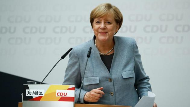German Chancellor Angela Merkel leaves after giving a press conference at the headquarters of the Christian Democratic Union (CDU) party in Berlin on September 25, 2017, one day after general elections. Merkel woke up to a fourth term but now faces the double headache of an emboldened hard-right opposition party and thorny coalition talks ahead (AFP)