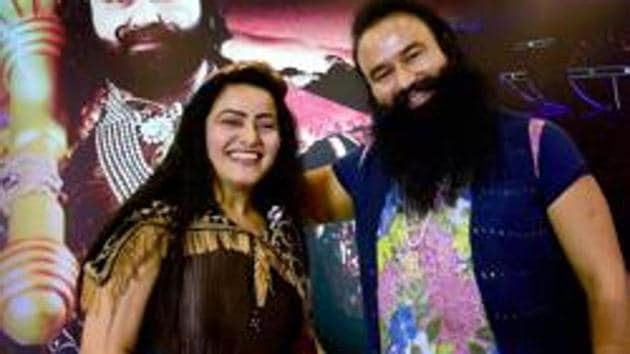 In this file photo, Honeypreet Insan is seen with jailed Dera Sacha Sauda chief Gurmeet Ram Rahim Singh.(PTI Photo)