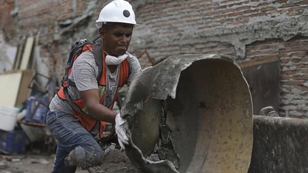 Hector Rodarte Cedillo, a 27-year-old window washer and candy salesman, lost his right leg below the knee seven years ago when a car ran him over. That hasn’t stopped him from toiling long hours in a brigade of civilian volunteers searching for survivors, aiding the injured and clearing the rubble of buildings that collapsed in Jojutla during last week’s deadly earthquake. (Miguel Tovar / AP) Hector Rodarte Cedillo, a 27-year-old window washer and candy salesman, lost his right leg below the knee seven years ago when a car ran him over. That hasn’t stopped him from toiling long hours in a brigade of civilian volunteers searching for survivors, aiding the injured and clearing the rubble of buildings that collapsed in Jojutla during last week’s deadly earthquake. (Miguel Tovar / AP)