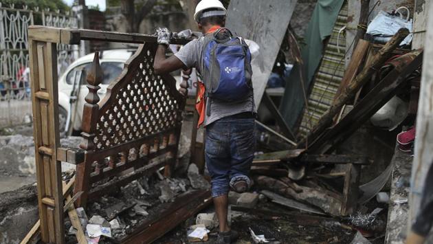 Hector Rodarte helps to salvage furniture from a neighbor's home, destroyed in the 7.1 magnitude earthquake that jolted Mexico last week. About 10% of the nearly 11,000 damaged buildings were constructed after strict building codes were enacted in the wake of the devastating 1985 earthquake that killed an estimated 10,000 people, Puente said, leading officials on Monday to instruct prosecutors to open investigations. (Miguel Tovar / AP) Hector Rodarte helps to salvage furniture from a neighbor's home, destroyed in the 7.1 magnitude earthquake that jolted Mexico last week. About 10% of the nearly 11,000 damaged buildings were constructed after strict building codes were enacted in the wake of the devastating 1985 earthquake that killed an estimated 10,000 people, Puente said, leading officials on Monday to instruct prosecutors to open investigations. (Miguel Tovar / AP)