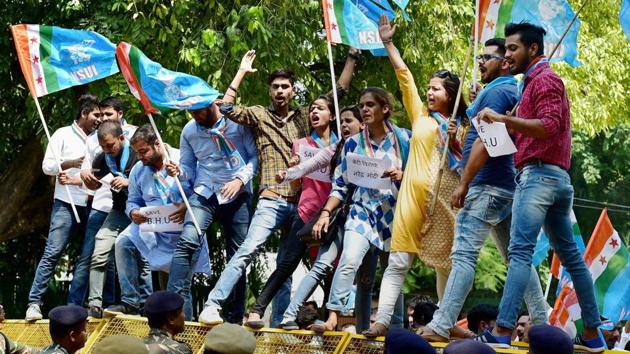 NSUI members shout slogans during a protest in New Delhi on Monday. Following the violence, the district administration declared holidays from September 26 till October 2 in all colleges and universities in Varanasi. The BHU had earlier announced that the holidays would start from September 28. The university also said that security guards were regularly patrolling the campus and assistance from the police had been sought to maintain peace. (PTI) NSUI members shout slogans during a protest in New Delhi on Monday. Following the violence, the district administration declared holidays from September 26 till October 2 in all colleges and universities in Varanasi. The BHU had earlier announced that the holidays would start from September 28. The university also said that security guards were regularly patrolling the campus and assistance from the police had been sought to maintain peace. (PTI)