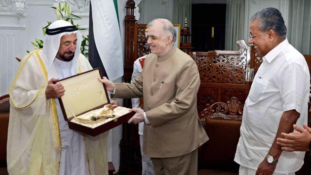 Kerala governor Justice P Sathasivam presenting a gift to Sheikh Sultan Bin Mohammed Al Qasimi, supreme council member and ruler of Sharjah, at Raj Bhavan in Thiruvananthapuram on Monday. (PTI Photo) Kerala governor Justice P Sathasivam presenting a gift to Sheikh Sultan Bin Mohammed Al Qasimi, supreme council member and ruler of Sharjah, at Raj Bhavan in Thiruvananthapuram on Monday. (PTI Photo)