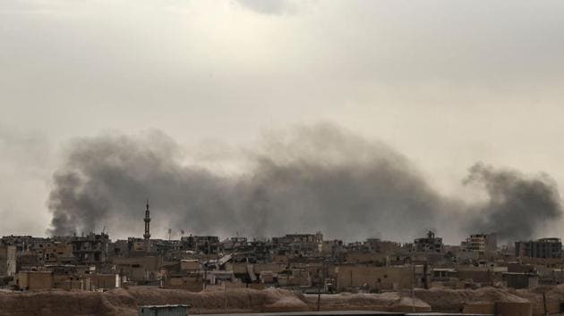 US-led coalition air strikes hit near the silos and stadium on Thursday, sending clouds of grey smoke into the air above. ‘There are tunnels that connect several strategic places. She said IS fighters had holed up inside the Raqa national hospital, the local sports stadium and several parks nearby. We’re trying to seize the national hospital but Daesh is holding civilians inside it as human shields and that is slowing our progress.’ she added. (Bulent Kilic / AFP) 