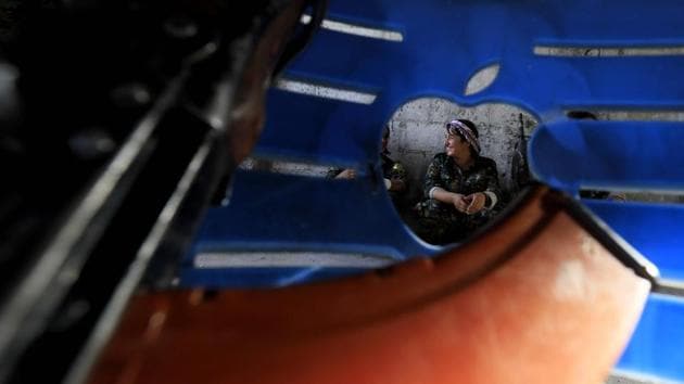 IS has lost much of its territory in Syria this year under offensives by the SDF and the Russia-backed Syrian military. Its fighters have fallen back to its last major footholds --the cities and towns in the fertile strip along the Euphrates. SDF officials estimate that 700-1,000 Islamic State fighters are holed up in a pocket in the city. Ahmed said she did not expect them to surrender and the SDF would never allow them passage out. (Delil Souleiman / AFP) 