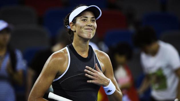 Garbine Muguruza of Spain celebrates after beating Lesia Tsurenko of Ukraine during the second round of the WTA Wuhan Open tennis tournament on Tuesday. (AFP) Garbine Muguruza of Spain celebrates after beating Lesia Tsurenko of Ukraine during the second round of the WTA Wuhan Open tennis tournament on Tuesday. (AFP)