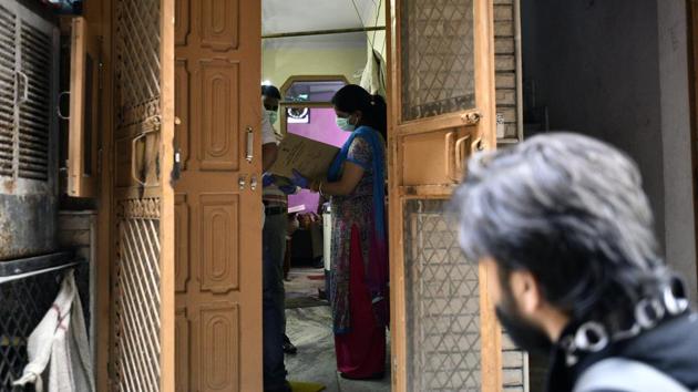 Delhi police personnel conduct investigation after double murder at Wazirabad Village in New Delhi on Monday. (Arun Sharma/HT PHOTO) Delhi police personnel conduct investigation after double murder at Wazirabad Village in New Delhi on Monday. (Arun Sharma/HT PHOTO)
