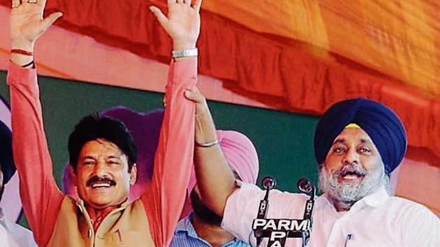 SAD chief Sukhbir Singh Badal at a rally to support SAD-BJP candidate Swarn Singh Salaria (left) for the byelections.(HT Photo)