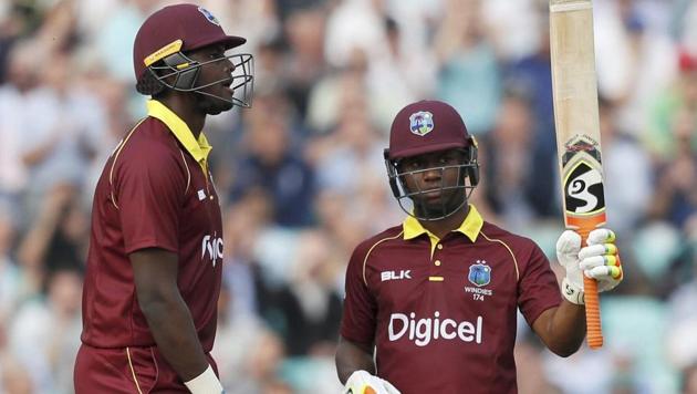 West Indies' Evin Lewis, right, celebrates scoring 176 runs during the 4th ODI against England at The Oval in London on Wednesday. (AP) West Indies' Evin Lewis, right, celebrates scoring 176 runs during the 4th ODI against England at The Oval in London on Wednesday. (AP)