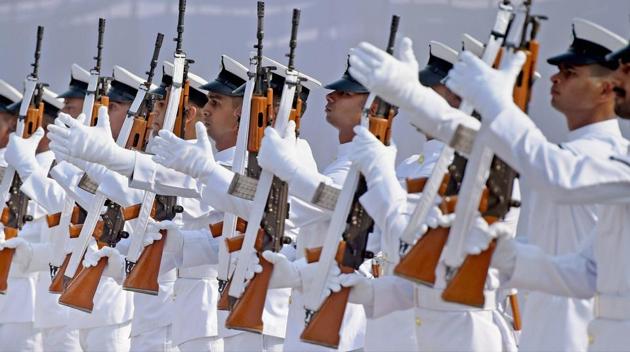 Navy soldiers perform a drill during the commissioning of INS Tarasa, Water Jet Fast Attack Crafts (WJFAC) in Mumbai. Besides coastal and offshore surveillance, Tarasa is described as an ideal platform to render missions like EEZ Patrol, law enforcement, non-military missions like search and rescue, humanitarian assistance and disaster relief. (Shashank Parade / PTI)