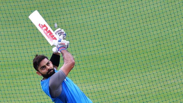 Captain Virat Kohli bats during a practice session ahead of the fourth ODI at the M. Chinnaswamy Stadium in Bangalore.  (AFP) 