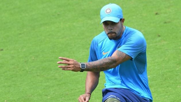 Indian cricketer Umesh Yadav warms up during a practice session held ahead of the fourth ODI at the M. Chinnaswamy Stadium in Bangalore.  (AFP) 