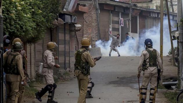 A Kashmiri protester throws a rock at security forces during a protest in Srinagar.(AP file photo)