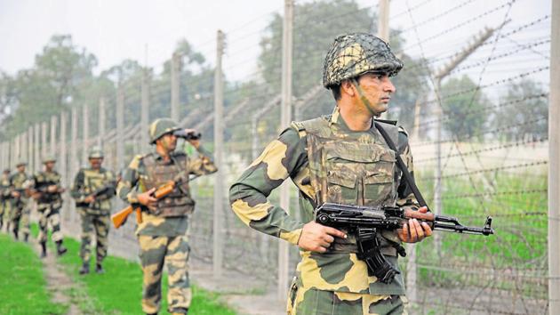 Border Security Force soldiers patrol the India-Pakistan border.(AP File Photo)
