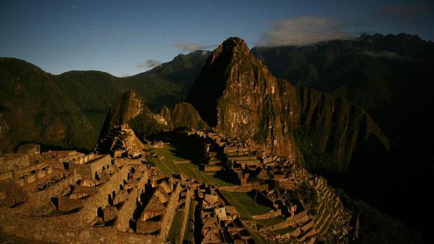 Macchu Pichu as seen under a golden sun in Peru. This Inca city seems forever stuck in time and was never revealed to the warrior Spaniards until the early part of the 20th century. Today is however a different story, as 2500 people arrive there daily during peak season. (Brent Stirton / Getty Images) Macchu Pichu as seen under a golden sun in Peru. This Inca city seems forever stuck in time and was never revealed to the warrior Spaniards until the early part of the 20th century. Today is however a different story, as 2500 people arrive there daily during peak season. (Brent Stirton / Getty Images)