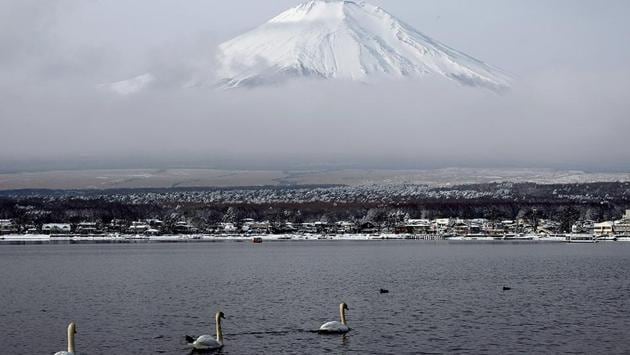 In the land of the rising sun, Mount Fuji is what is visible to most travelers from even the aeroplane. Here, the snow-capped peak is seen from the Yamanakako lake in Japan on a cold January day. (Koichi Kamoshida / Getty Images) In the land of the rising sun, Mount Fuji is what is visible to most travelers from even the aeroplane. Here, the snow-capped peak is seen from the Yamanakako lake in Japan on a cold January day. (Koichi Kamoshida / Getty Images)