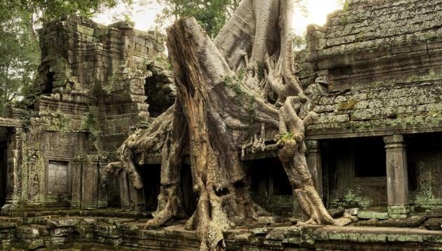 The Bayon Temple complex, housed within the Angkor Wat in Cambodia is a spectacle of ruins. Comprising the largest religious complex in the world, the temples inside Angkor Wat replicate the spatial universe in miniature. (Ian Walton / Getty Images) The Bayon Temple complex, housed within the Angkor Wat in Cambodia is a spectacle of ruins. Comprising the largest religious complex in the world, the temples inside Angkor Wat replicate the spatial universe in miniature. (Ian Walton / Getty Images)