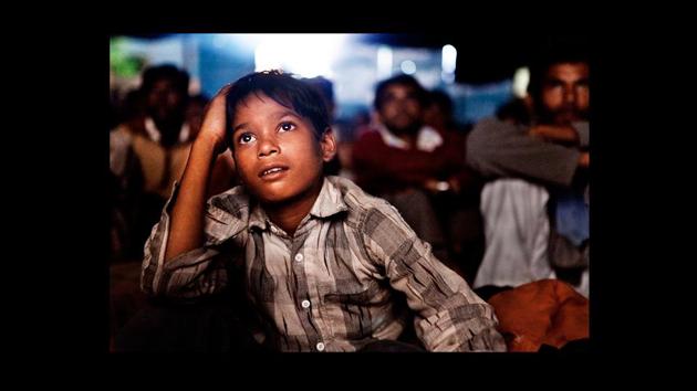 ‘Untitled’ by Amit Madheshiya. Cinephiles of all ages have enjoyed the magic of travelling cinemas, especially in rural India. For nearly seven decades now, these cinemas have been travelling as part of old religious fairs. (Photograph courtesy Amit Madheshiya / GALLERYSKE & PHOTOINK) ‘Untitled’ by Amit Madheshiya. Cinephiles of all ages have enjoyed the magic of travelling cinemas, especially in rural India. For nearly seven decades now, these cinemas have been travelling as part of old religious fairs. (Photograph courtesy Amit Madheshiya / GALLERYSKE & PHOTOINK)