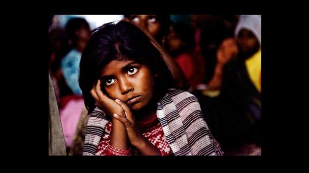 ‘Untitled’ by Amit Madheshiya. Says Madheshiya of his initial visits, ‘We did not know what we were seeking. But we found solace bunched up with excited children under a neem tree, where an old man was showing scraps of film on a hand cranked projector.’ (Photograph courtesy Amit Madheshiya / GALLERYSKE & PHOTOINK) ‘Untitled’ by Amit Madheshiya. Says Madheshiya of his initial visits, ‘We did not know what we were seeking. But we found solace bunched up with excited children under a neem tree, where an old man was showing scraps of film on a hand cranked projector.’ (Photograph courtesy Amit Madheshiya / GALLERYSKE & PHOTOINK)