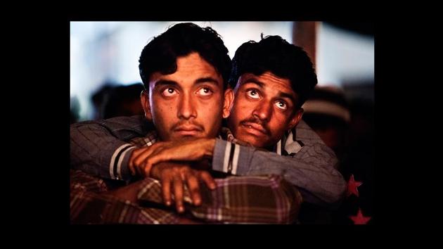 ‘Untitled’ by Amit Madheshiya. The uniqueness of this portrait series is how it maps the experience of those who’re part of the receiving end of these film screenings. For them, all that matters is on screen. (Photograph courtesy Amit Madheshiya / GALLERYSKE & PHOTOINK) ‘Untitled’ by Amit Madheshiya. The uniqueness of this portrait series is how it maps the experience of those who’re part of the receiving end of these film screenings. For them, all that matters is on screen. (Photograph courtesy Amit Madheshiya / GALLERYSKE & PHOTOINK)