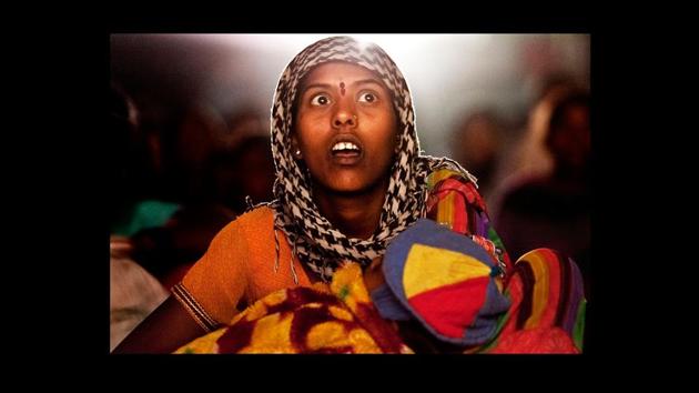 ‘Untitled’ by Amit Madheshiya. It is perhaps cinema’s greatest feat to extract human emotions in ways it’d have perhaps never intended to. That outcome is wonderfully interpreted and conveyed by Madheshiya, who uses the light from the screen to literally bring to life the larger-than-life experience of being part of a travelling cinema. (Photograph courtesy Amit Madheshiya / GALLERYSKE & PHOTOINK) ‘Untitled’ by Amit Madheshiya. It is perhaps cinema’s greatest feat to extract human emotions in ways it’d have perhaps never intended to. That outcome is wonderfully interpreted and conveyed by Madheshiya, who uses the light from the screen to literally bring to life the larger-than-life experience of being part of a travelling cinema. (Photograph courtesy Amit Madheshiya / GALLERYSKE & PHOTOINK)