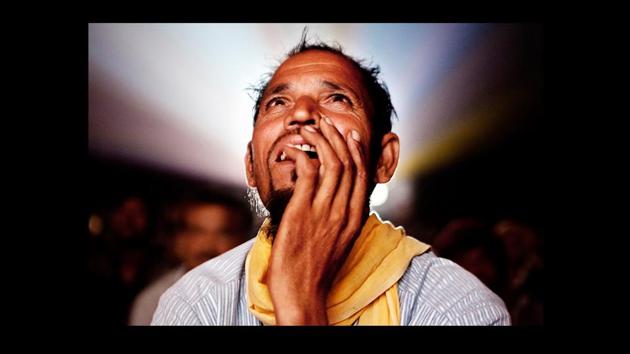 ‘Untitled’ from Amit Madheshiya’s ‘The Cinema Travellers.’ The faces of cinema-goers are lit up by the large screen on which they watch the films. Madheshiya won the World Press Photo in 2011, the World Photography Award in 2009 & 2011, as well as the Grand Prize at the Humanity Photo Awards in 2009 for this work.