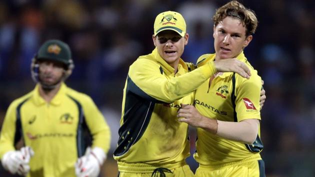 Adam Zampa, right and captain Steven Smith celebrate Indian batsman Hardik Pandya's wicket. (AP) Adam Zampa, right and captain Steven Smith celebrate Indian batsman Hardik Pandya's wicket. (AP)