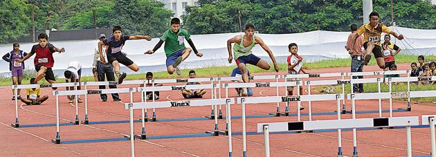 The under-14 boys hurdles event at Balewadi as part of the inter-school athletics tournament. Vivek Yadav of Shanu Patel school claimed the title, with Danish Chandagi of St Vincent’s School and Amogh Sathe of Shamrao Kalmadi School placed second and third respectively.(HT PHOTO)