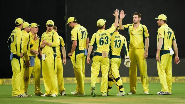 Australia's Kane Richardson with team mates celebrates the wicket of India's Ajinkya Rahane. (PTI) Australia's Kane Richardson with team mates celebrates the wicket of India's Ajinkya Rahane. (PTI)