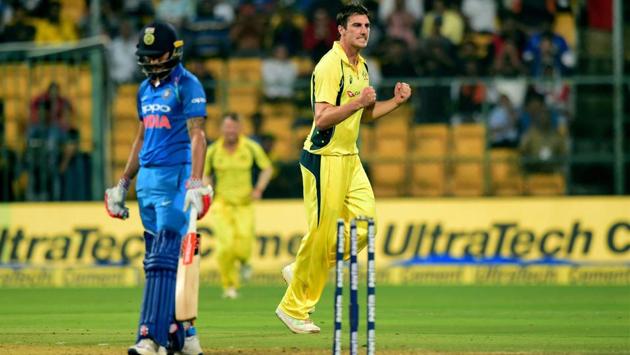 Australia's Pat Cummins celebrates the wicket of India's Manish Pandey. (PTI) Australia's Pat Cummins celebrates the wicket of India's Manish Pandey. (PTI)