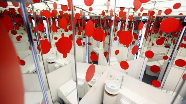 ‘I still see hallucinations even now,’ said Kusama, wearing her trademark scarlet wig and an orange and black dress derived from her artwork. ‘Dots come flying everywhere - on my dress, the floor, things I’m carrying, throughout the house, the ceiling. And I paint them.’ The dots that have helped make her name are present throughout the museum, which opens on Oct 1 - including in the toilet, where mirrors amplify their impact. (Toru Hanai / REUTERS) 
