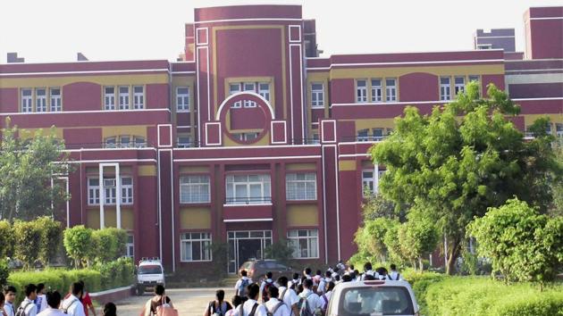 Students arrive at Gurugram's Ryan International School which re-opened on September 25. (PTI Photo) Students arrive at Gurugram's Ryan International School which re-opened on September 25. (PTI Photo)