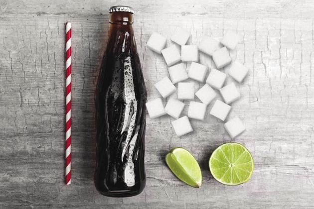 A large fountain Coke or Pepsi of the sort they have in cinema halls, can contain upto 27 spoons of sugar (Photo Imaging: Piyush Garg) A large fountain Coke or Pepsi of the sort they have in cinema halls, can contain upto 27 spoons of sugar (Photo Imaging: Piyush Garg)