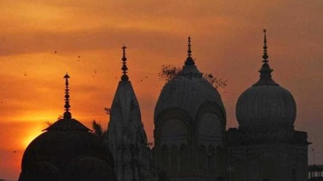 Birds fly at sunset over a temple in Ayodhya. (Ap File Photo) Birds fly at sunset over a temple in Ayodhya. (Ap File Photo)