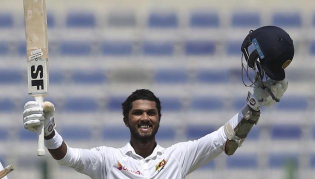 Dinesh Chandimal celebrates his century on Day 2 of the first Test cricket match between Pakistan and Sri Lanka at Sheikh Zayed Stadium in Abu Dhabi. Catch full cricket score and live cricket updates of Day 2 here(AP)