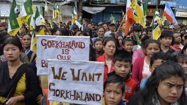 Supporters of the Gorkha Janmukti Morcha (GJM) taking part in a protest amid a strike called by the GJM in Darjeeling. The indefinite strike and shutdown came to an end on September 27 after 104 days.(AFP Photo) Supporters of the Gorkha Janmukti Morcha (GJM) taking part in a protest amid a strike called by the GJM in Darjeeling. The indefinite strike and shutdown came to an end on September 27 after 104 days.(AFP Photo)