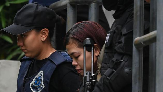 This photo taken on March 1, 2017 shows Indonesian national Siti Aisyah (C), 25, being escorted with a heavy police presence after a court appearance with Vietnamese national Doan Thi Huong, 28, at the magistrates' court in Sepang, for their alleged role in the assassination of Kim Jong-Nam, the half-brother of North Korean leader Kim Jong-Un.(AFP File Photo) This photo taken on March 1, 2017 shows Indonesian national Siti Aisyah (C), 25, being escorted with a heavy police presence after a court appearance with Vietnamese national Doan Thi Huong, 28, at the magistrates' court in Sepang, for their alleged role in the assassination of Kim Jong-Nam, the half-brother of North Korean leader Kim Jong-Un.(AFP File Photo)