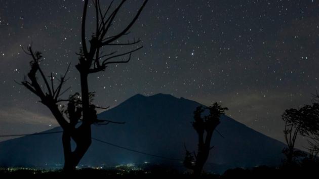 Indonesian authorities are also on standby to divert flights destined for Bali. ‘We could say that the chance of an eruption is very high, above 50 percent,’ said Swantika. Entering the exclusion zone would be extraordinarily risky. ‘I would not go now. The activity is too high and the risk much too large,’ Boutelier said. The pyroclastic flow, a rush of hot gas, ash and other volcanic material, would ‘kill everyone in its path in a few seconds,’ he added. (Bay Ismoyo / AFP) Indonesian authorities are also on standby to divert flights destined for Bali. ‘We could say that the chance of an eruption is very high, above 50 percent,’ said Swantika. Entering the exclusion zone would be extraordinarily risky. ‘I would not go now. The activity is too high and the risk much too large,’ Boutelier said. The pyroclastic flow, a rush of hot gas, ash and other volcanic material, would ‘kill everyone in its path in a few seconds,’ he added. (Bay Ismoyo / AFP)