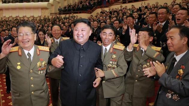 This undated picture released by North Korea's official Korean Central News Agency (KCNA) on September 10, 2017 shows North Korean leader Kim Jong-Un (front 2nd L) attending an art performance dedicated to nuclear scientists and technicians, who worked on a hydrogen bomb which the regime claimed to have successfully tested, at the People's Theatre in Pyongyang. /(AFP)