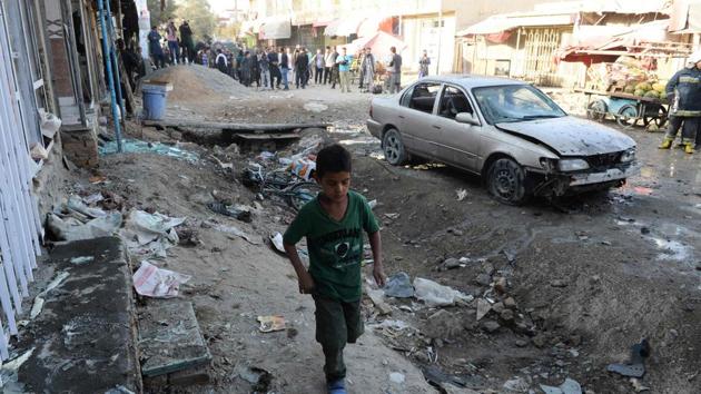 Afghan boys walks at the site of a suicide bomb attack near a Shiite mosque in Kabul on September 29. (AFP) Afghan boys walks at the site of a suicide bomb attack near a Shiite mosque in Kabul on September 29. (AFP)