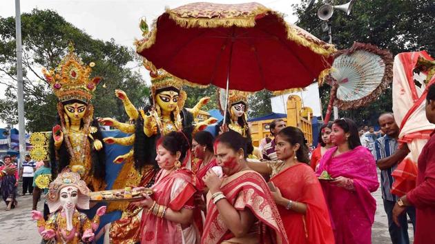 Women devotees participate in the immersion of the Idol of Goddess Durga in Kolkata on Saturday.(PTI)