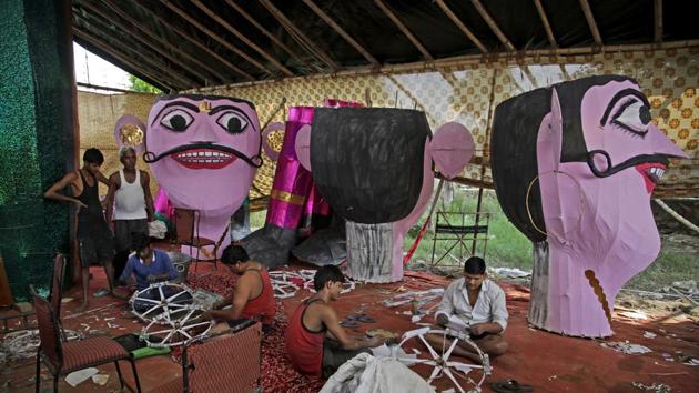 Work on gigantic Ravana effigies made from bamboo, wire and paper begins several months in advance of Dussehra.(Altaf Qadri / AP)