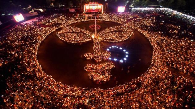 Thousands of Devotees in form an image holding candles of the deity Amba during a ‘Maha Aarti’ on Maha Ashtami of the Navratri period in Gandhinagar, Gujarat on September 29, 2017. (PTI) Thousands of Devotees in form an image holding candles of the deity Amba during a ‘Maha Aarti’ on Maha Ashtami of the Navratri period in Gandhinagar, Gujarat on September 29, 2017. (PTI)