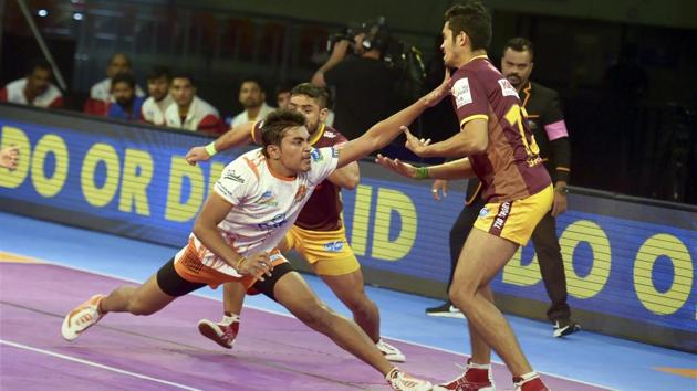 Players of Puneri Paltan (white jersey) and UP Yoddha in action during a Pro Kabaddi League match at Jawaharlal Nehru Indoor Stadium in Chennai on Saturday. (PTI) Players of Puneri Paltan (white jersey) and UP Yoddha in action during a Pro Kabaddi League match at Jawaharlal Nehru Indoor Stadium in Chennai on Saturday. (PTI)